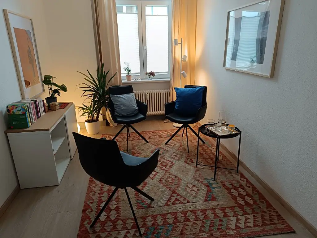 a room with chairs and a table